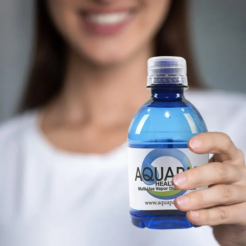 With the current distilled water shortage people aren’t sure where to buy distilled water from. Aquapap is the answer. Women holding Aquapap vapor distilled water bottle.