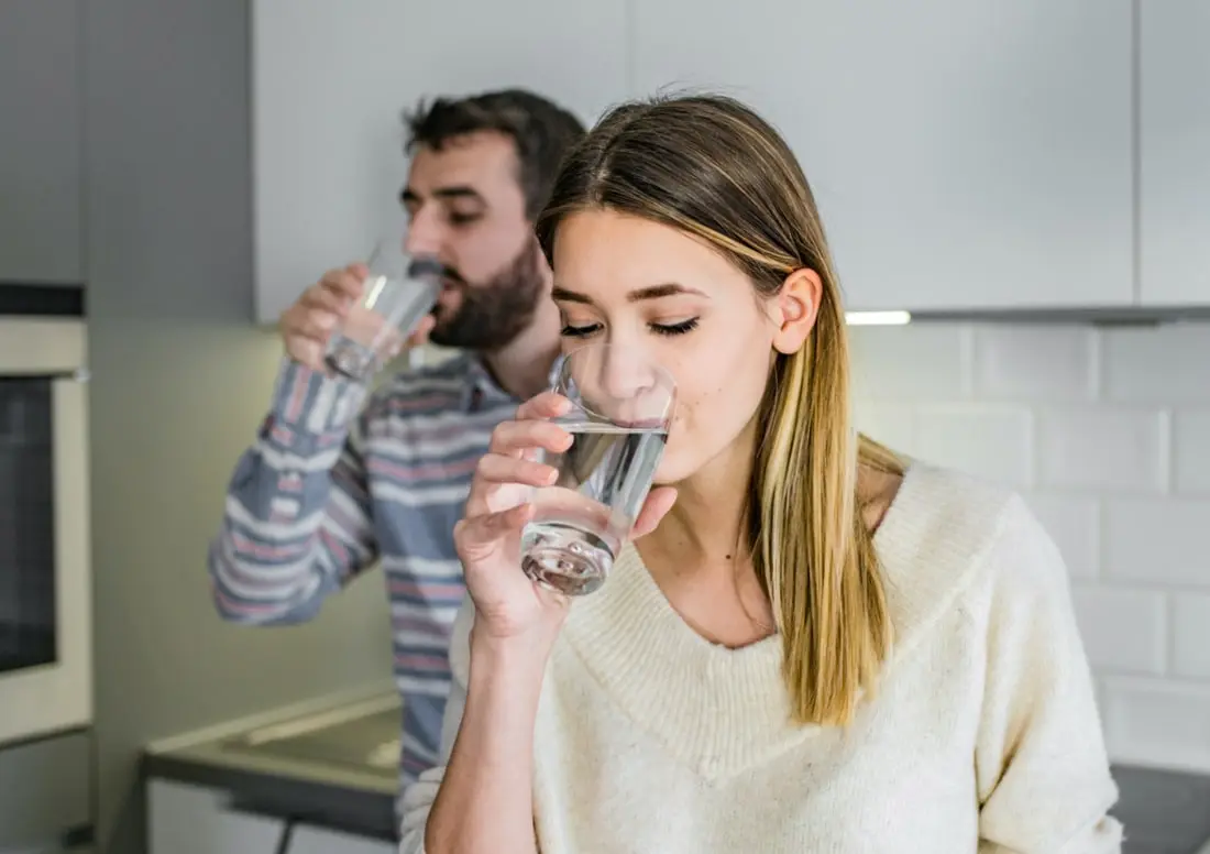 Couple drinking distilled water